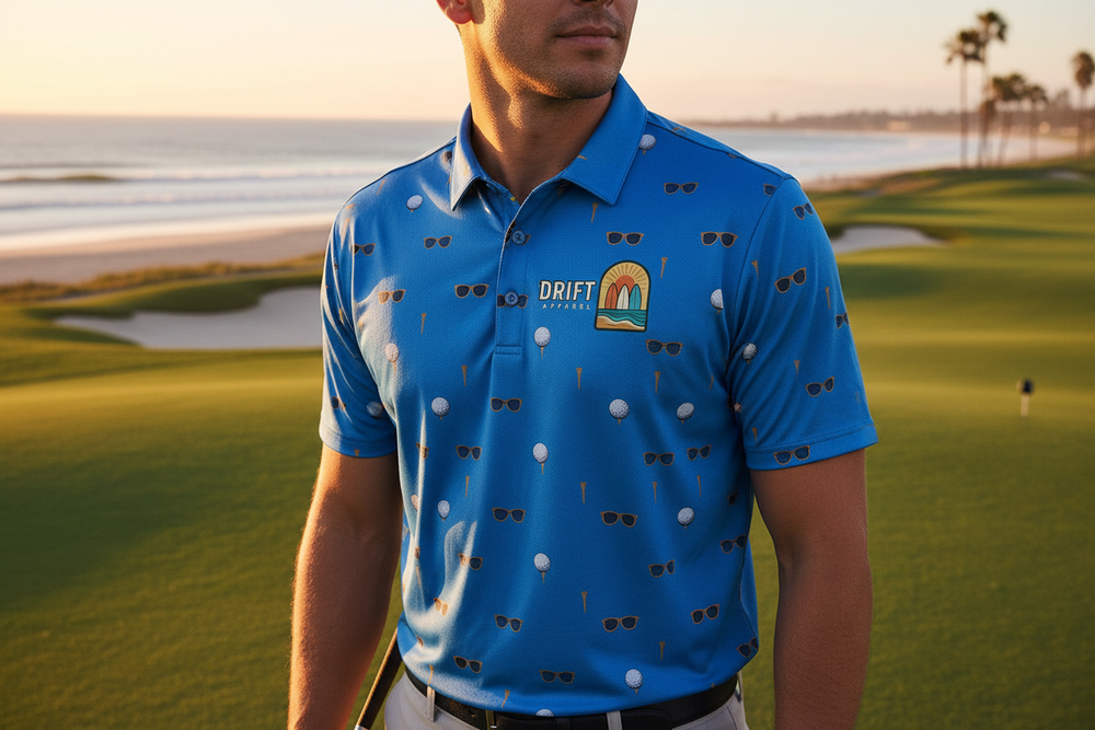 Person wearing blue Drift Apparel golf shirt at beachfront golf club